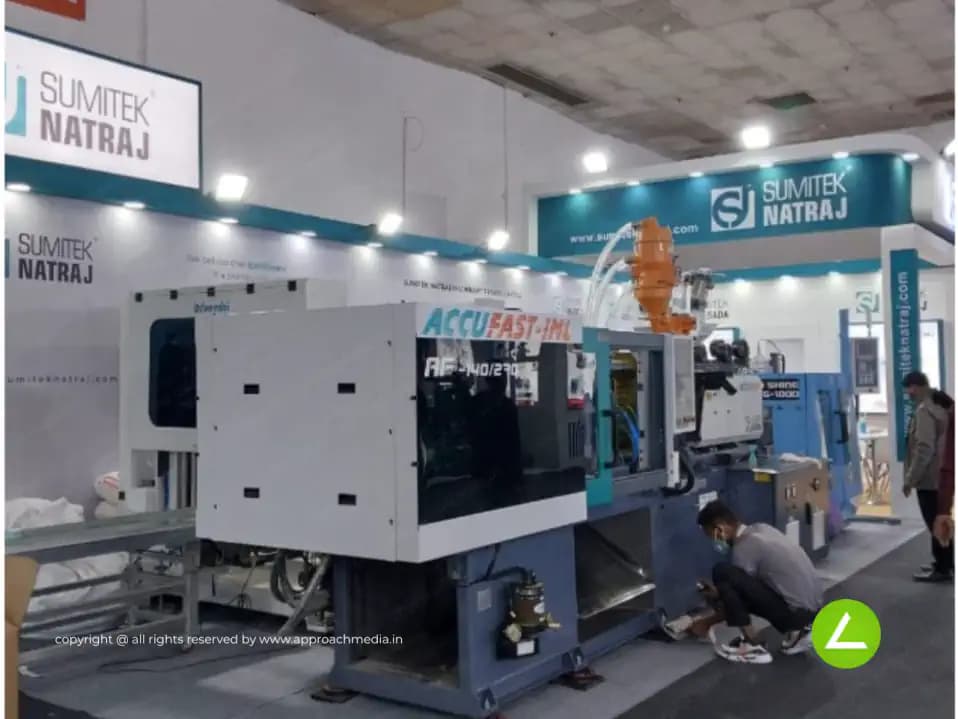 Plastic Machinery Exhibition Stall Design at Plast India Delhi — 27 sqm 2 side open trade show booth for SNMPL at Plast India Expo 2022, 2022