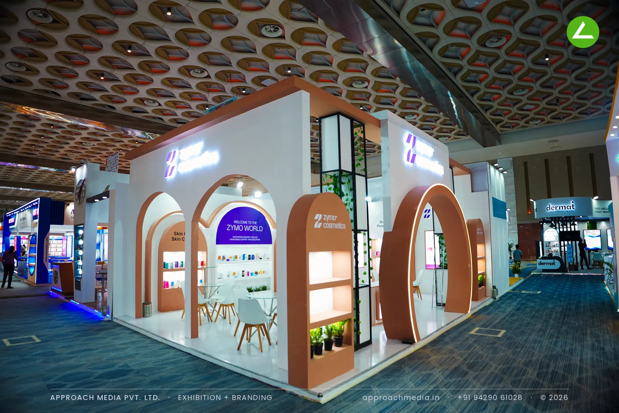 Zymo Cosmetics exhibition stall design at CMPL Expo Mumbai with terracotta arches and backlit product niches in white