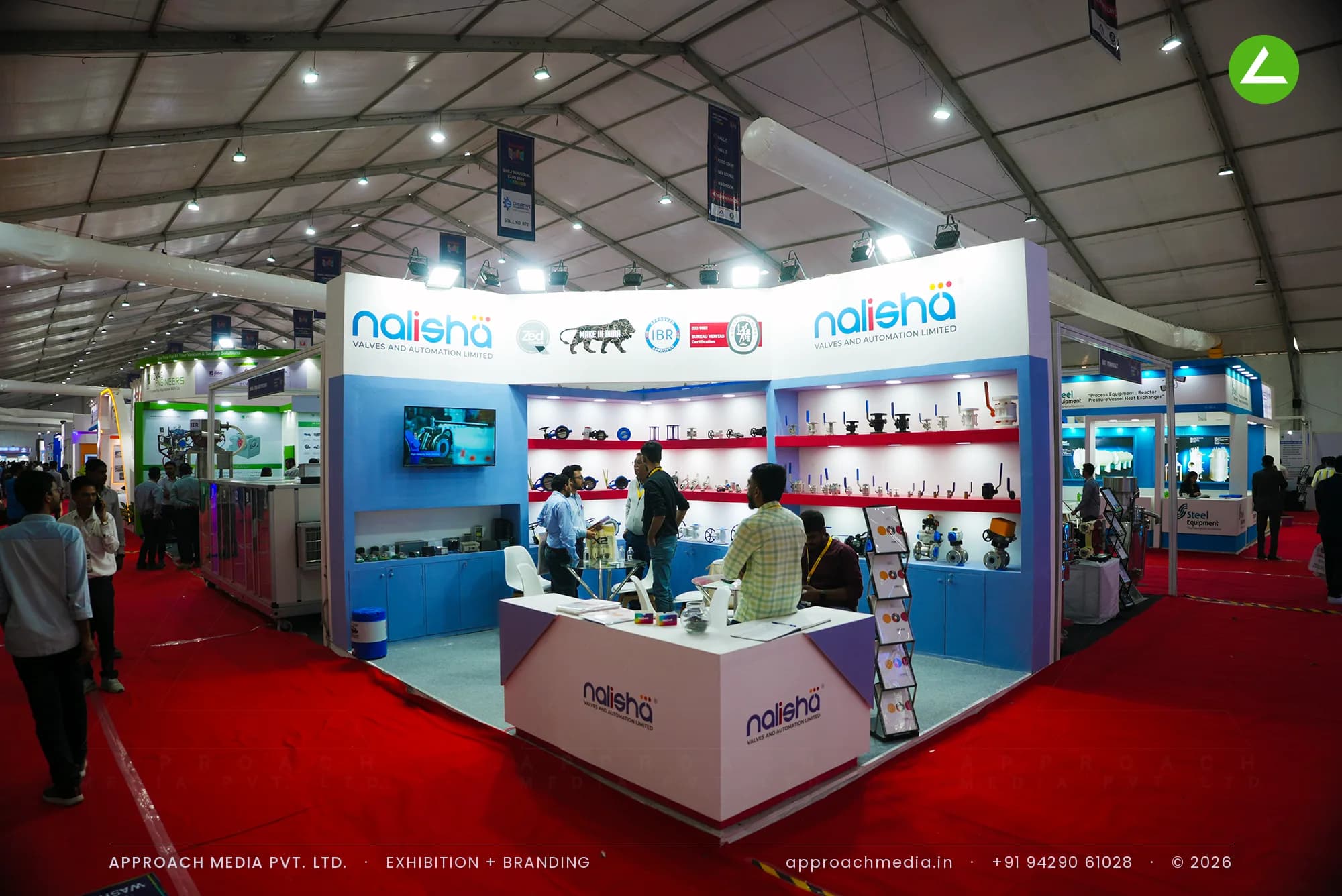 Nalisha exhibition stall design at Dahej Industrial Expo Dahej with red-lit shelf wall displaying the valve range