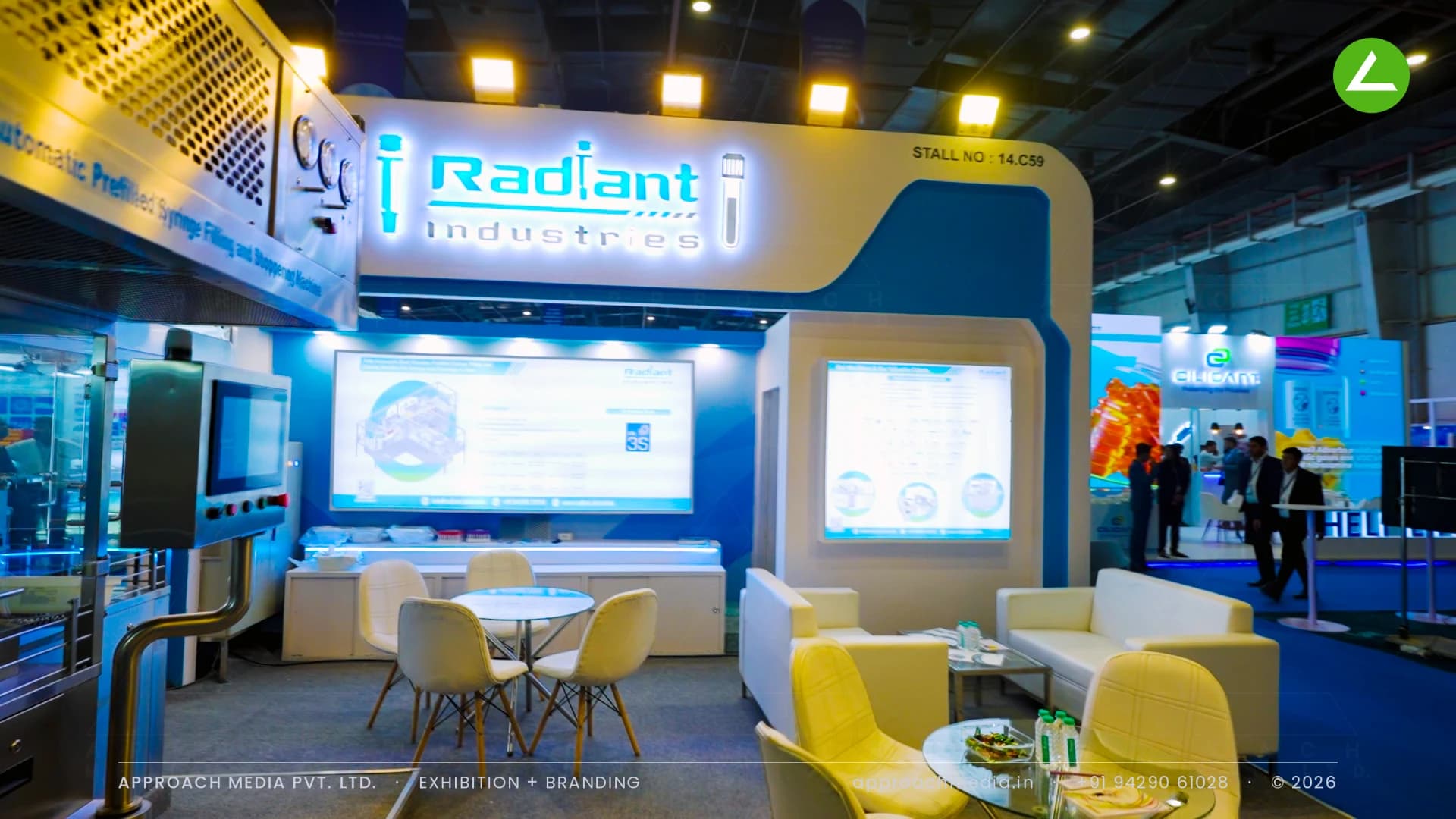Radiant Industries exhibition stall design at CPHI Greater Noida with lit channel-letter logo and live syringe filling line