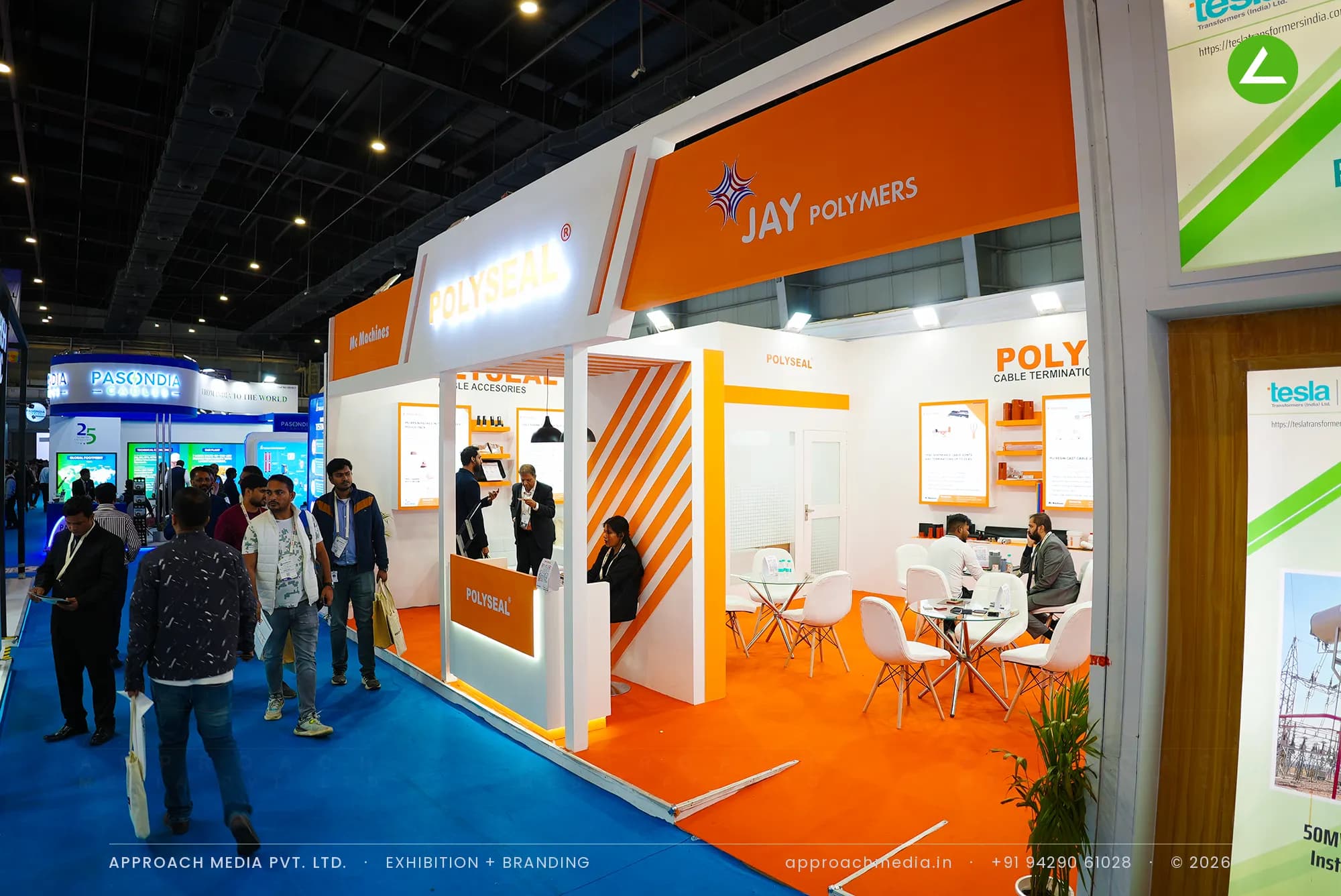 Polyseal orange and white exhibition stall design at ELECRAMA Greater Noida with backlit lettering and perimeter counters