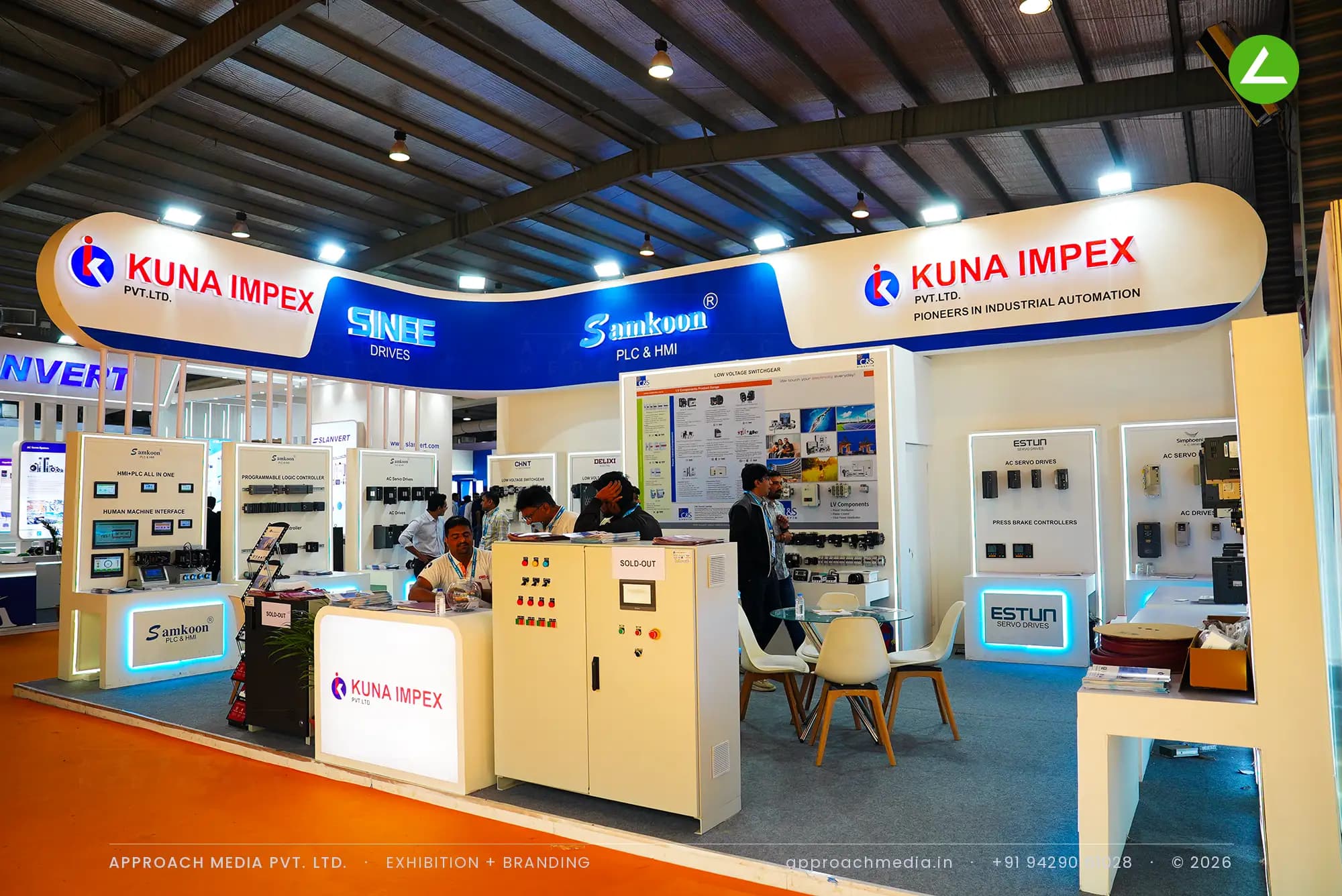 Kuna Impex exhibition stall design at EngiMach Gandhinagar with a capsule brand fascia and edge-lit product plinths