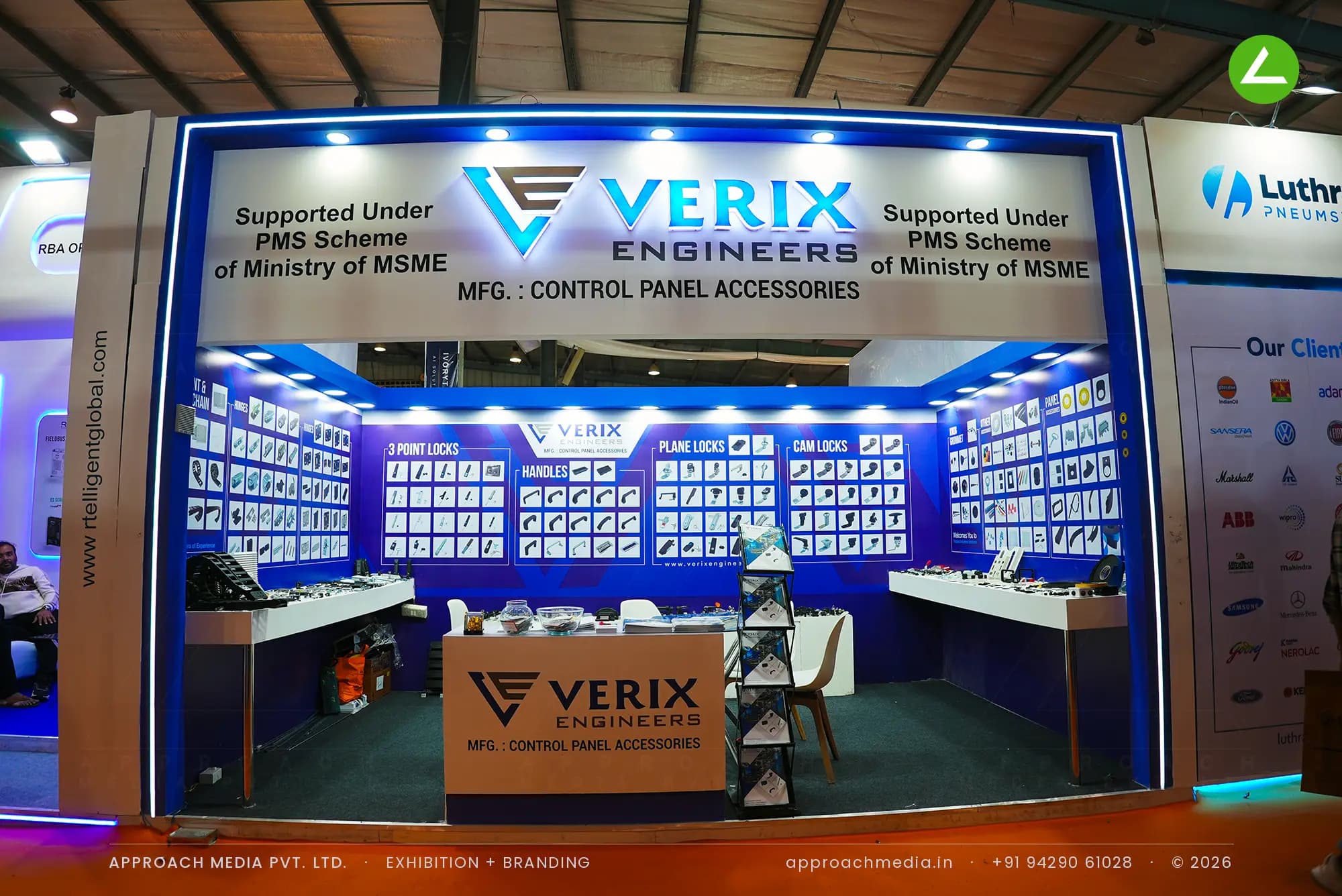 Verix Engineers exhibition stall design at EngiMach Gandhinagar with blue product catalogue walls and a lit portal frame