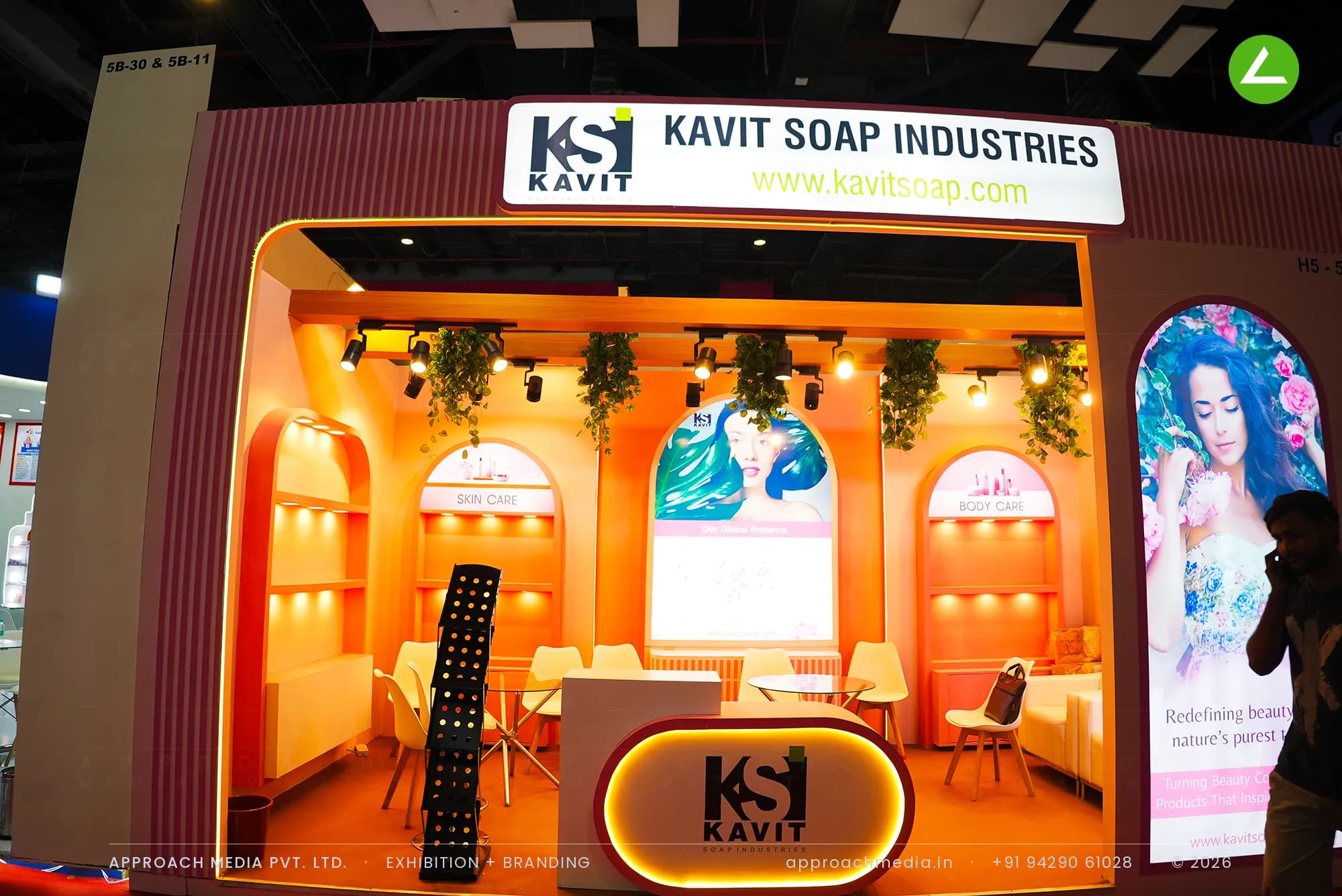 Kavit Soap Industries exhibition stall design at iPHEX New Delhi with peach arched niches and warm shelf lighting