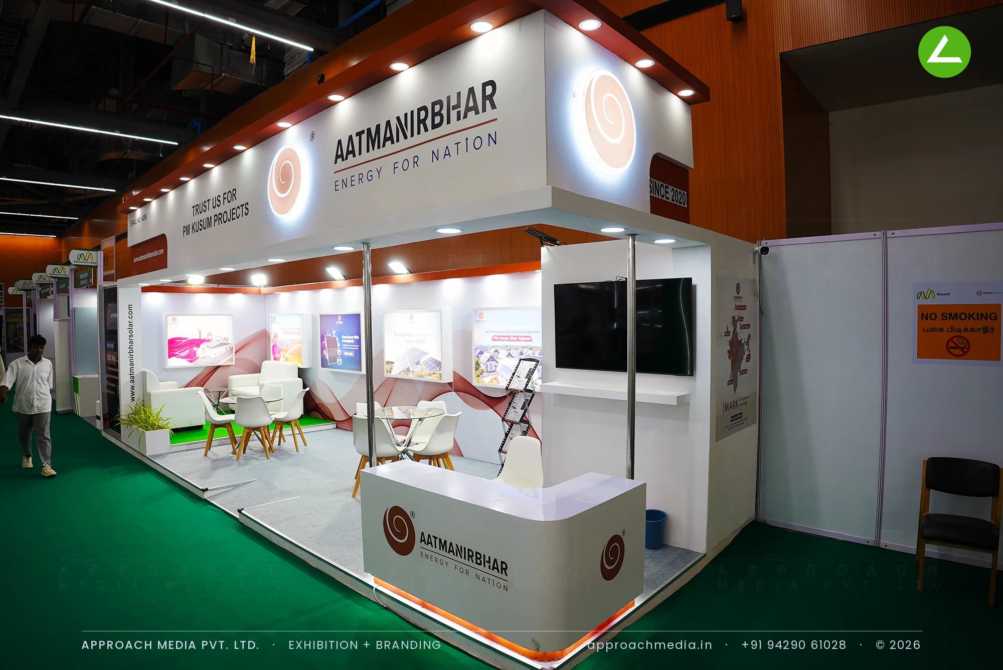 Aatmanirbhar white and terracotta solar stall with backlit logo disc, exhibition stall design at REI Expo Chennai