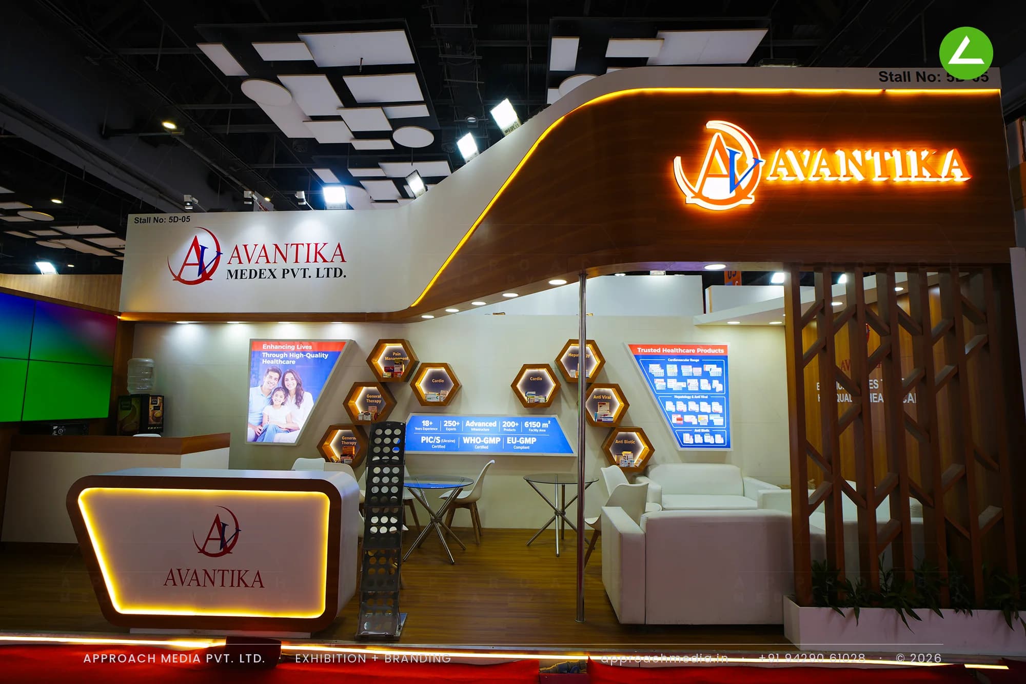 Avantika's curved wood fascia and lit hexagonal niches, an exhibition stall design at IPHEX New Delhi