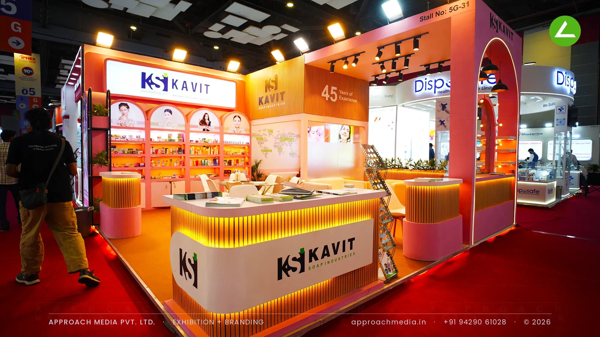 Kavit Soap Industries coral stand with fluted counter and arched shelves, exhibition stall design at IPHEX New Delhi