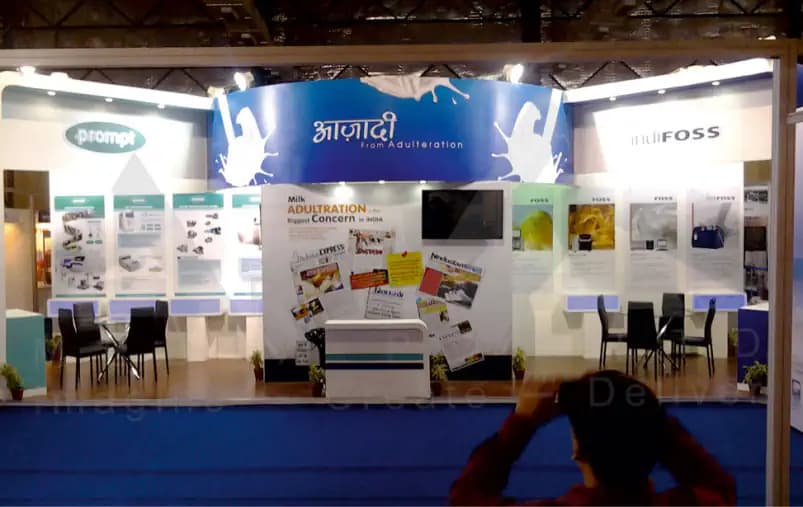 Dairy Lab Equipment Exhibition Stall Design at IAI Dairy Expo Hyderabad — 48 sqm 1 side open trade show booth for IndiFoss and Prompt at IAI Dairy Expo