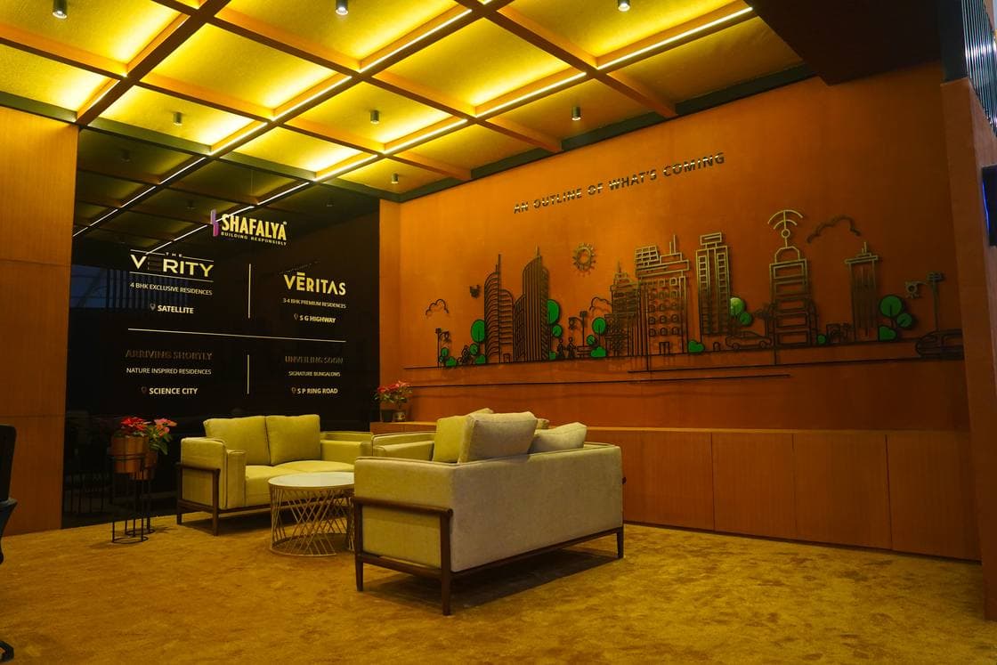 Close detail of premium booth materials — veneer, steel joinery and edge-lit acrylic