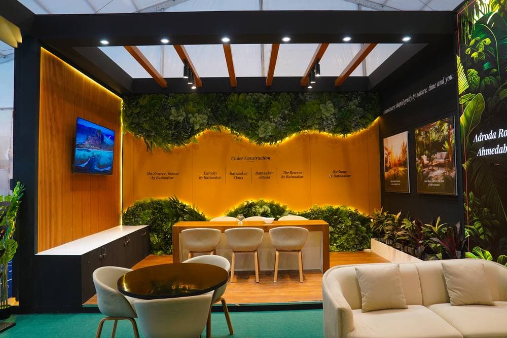 Custom booth with structural steel frame and premium wood veneer finishes